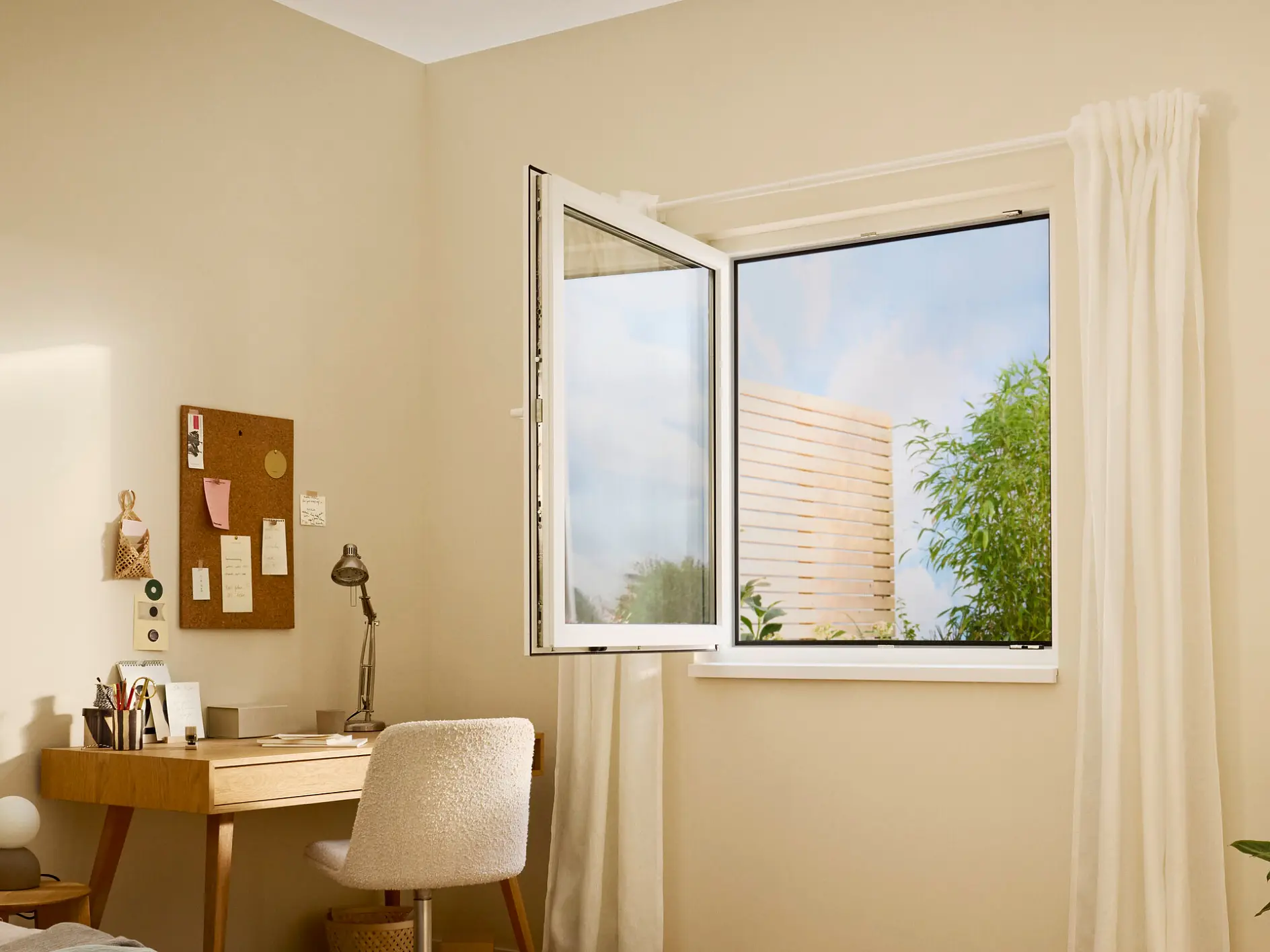 bright home office with wooden desk, chair, open window showing greenery outside, and neutral beige walls with minimal decor (global.generated_by_ai)